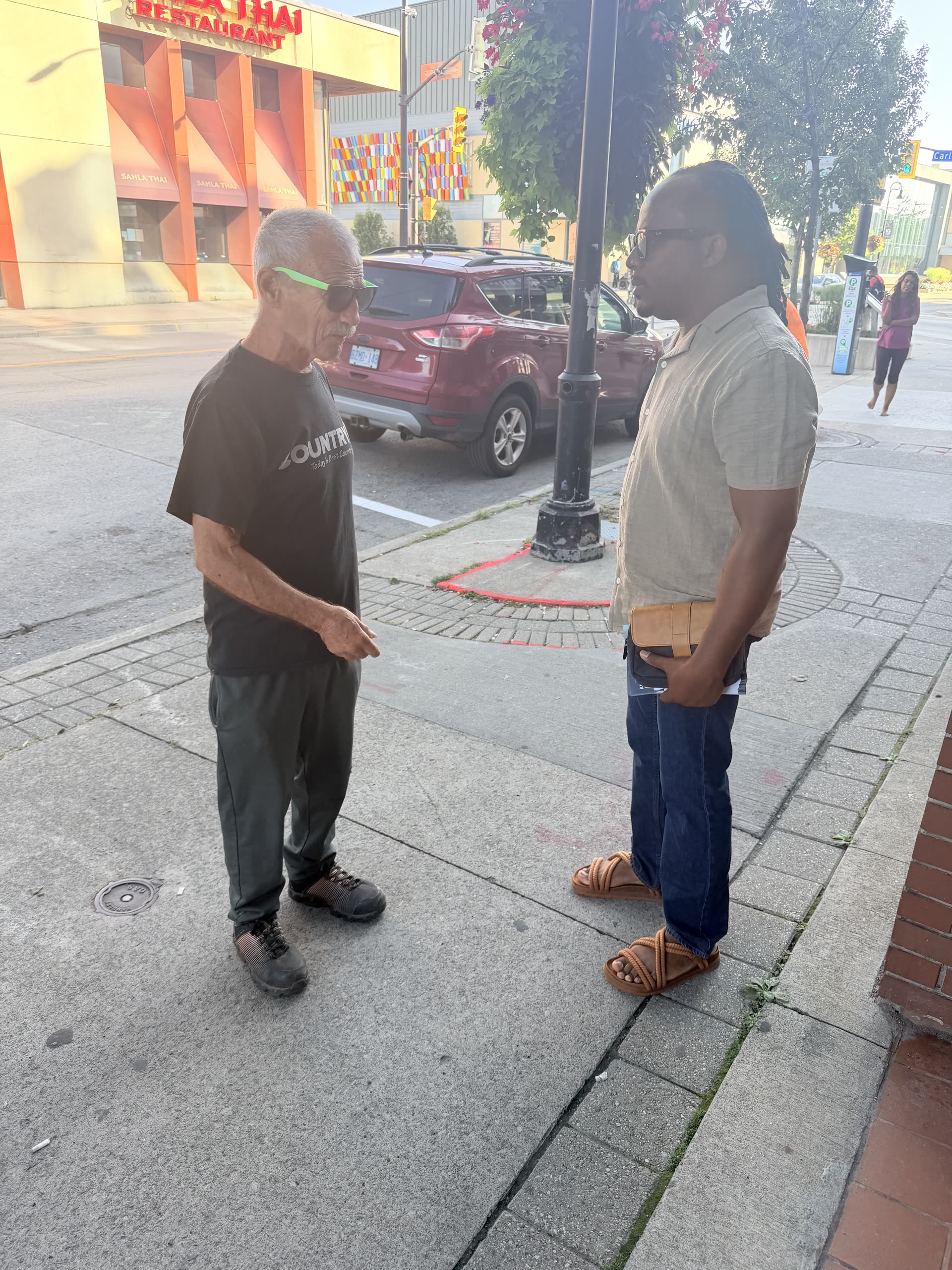 Anthony speaking with a resident in downtown St. Catharines