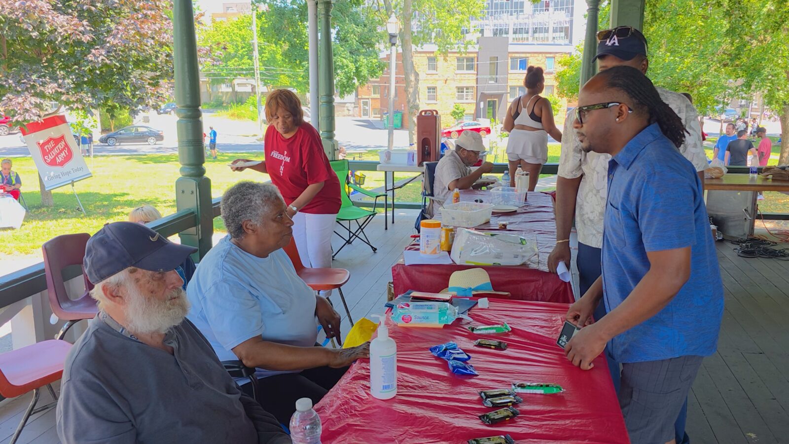 Anthony engaging with community members at a faith-based outreach event