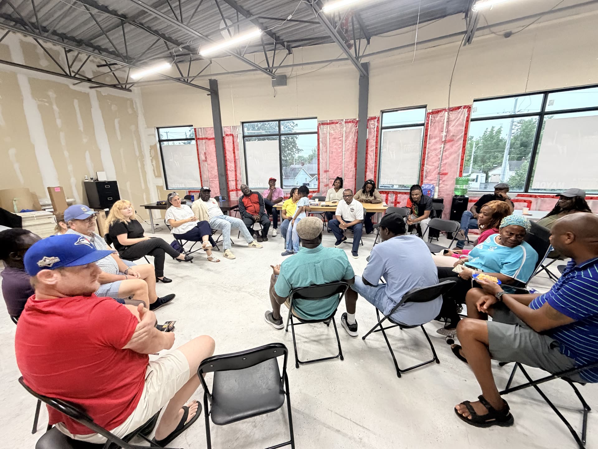 Anthony addresses the crowd at the campaign launch community meeting